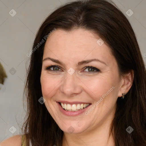 Joyful white adult female with long  brown hair and brown eyes