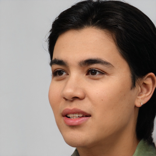 Joyful asian young-adult male with medium  black hair and brown eyes