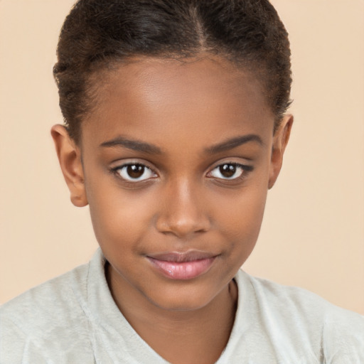 Joyful black child female with short  brown hair and brown eyes