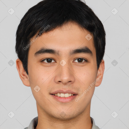 Joyful asian young-adult male with short  brown hair and brown eyes