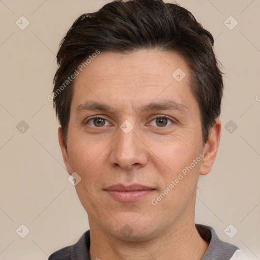 Joyful white adult male with short  brown hair and brown eyes