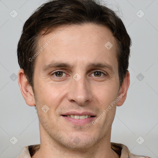 Joyful white adult male with short  brown hair and grey eyes