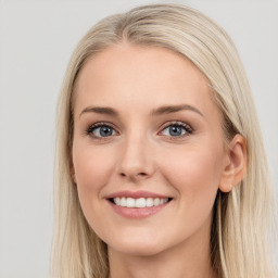 Joyful white young-adult female with long  brown hair and blue eyes