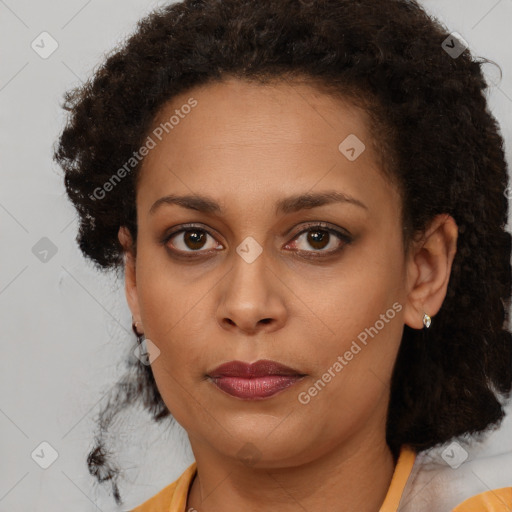 Joyful black young-adult female with medium  brown hair and brown eyes