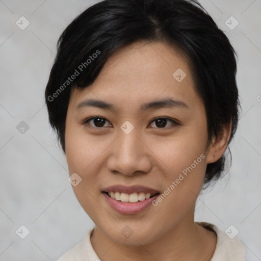 Joyful asian young-adult female with medium  black hair and brown eyes