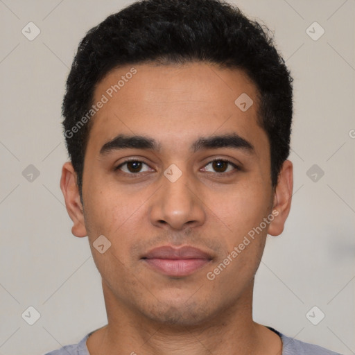 Neutral latino young-adult male with short  black hair and brown eyes