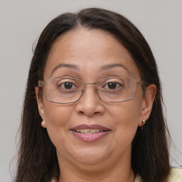 Joyful white adult female with medium  brown hair and brown eyes