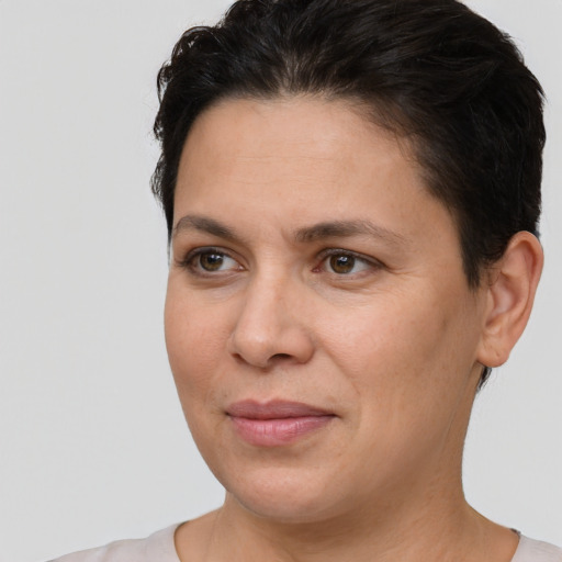 Joyful white adult female with short  brown hair and brown eyes