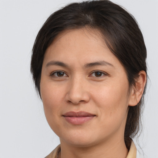 Joyful white young-adult female with medium  brown hair and brown eyes