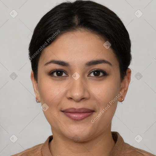 Joyful latino young-adult female with short  black hair and brown eyes