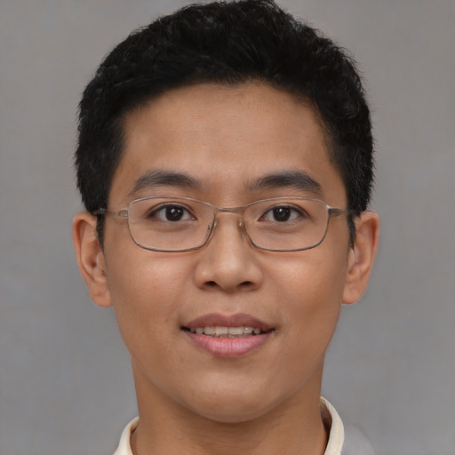 Joyful asian young-adult male with short  brown hair and brown eyes