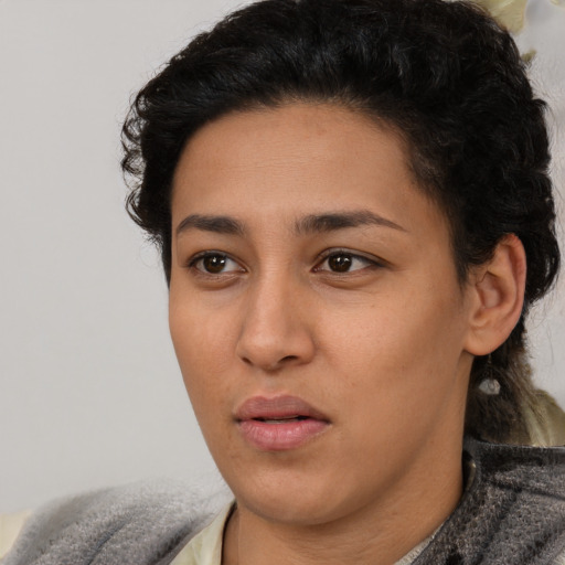Neutral latino young-adult female with short  black hair and brown eyes