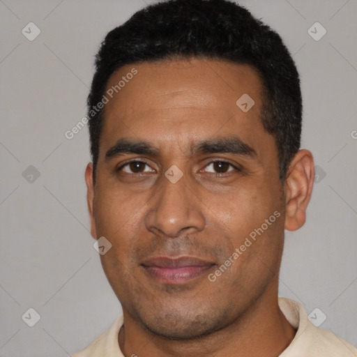 Joyful black young-adult male with short  black hair and brown eyes