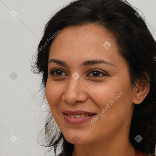 Joyful latino young-adult female with medium  brown hair and brown eyes