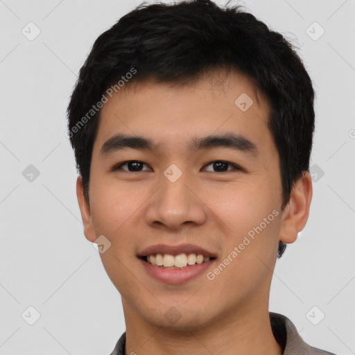 Joyful asian young-adult male with short  black hair and brown eyes