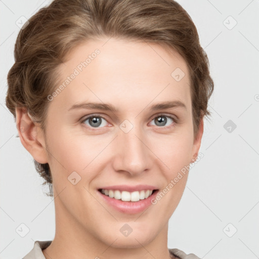 Joyful white young-adult female with short  brown hair and grey eyes