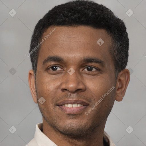 Joyful latino young-adult male with short  brown hair and brown eyes