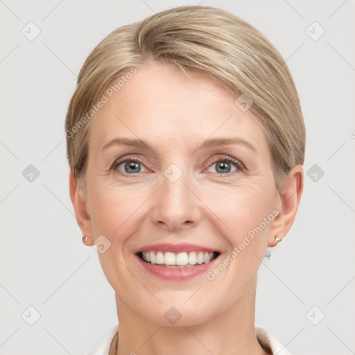 Joyful white adult female with short  brown hair and grey eyes