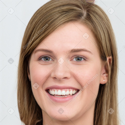 Joyful white young-adult female with long  brown hair and blue eyes