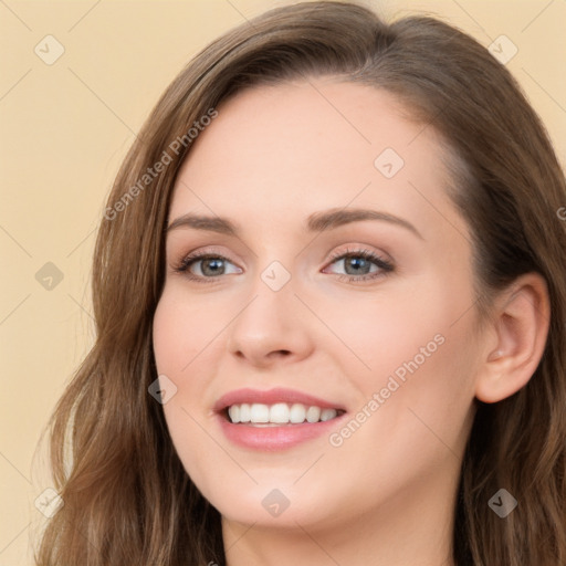 Joyful white young-adult female with long  brown hair and blue eyes