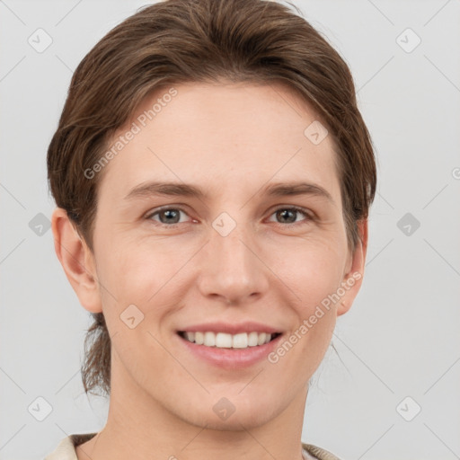 Joyful white young-adult female with short  brown hair and grey eyes