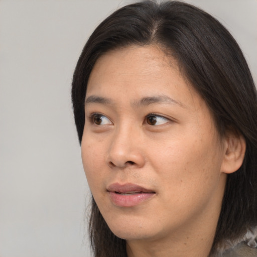 Neutral asian young-adult female with long  brown hair and brown eyes