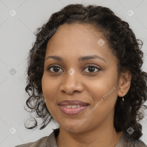 Joyful black young-adult female with medium  brown hair and brown eyes