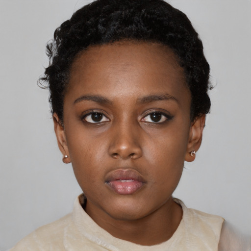 Neutral black young-adult female with short  black hair and brown eyes