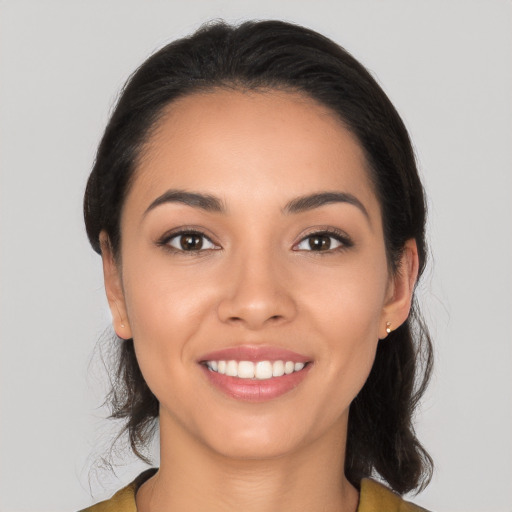 Joyful white young-adult female with long  black hair and brown eyes