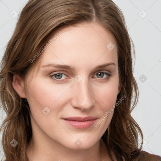 Joyful white young-adult female with long  brown hair and blue eyes