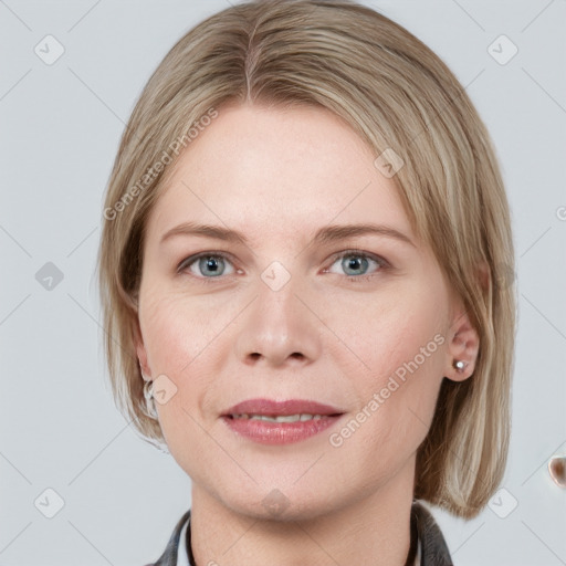 Joyful white young-adult female with medium  brown hair and blue eyes