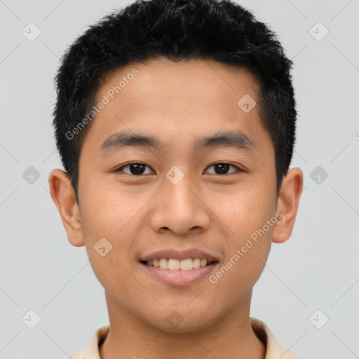 Joyful asian young-adult male with short  brown hair and brown eyes