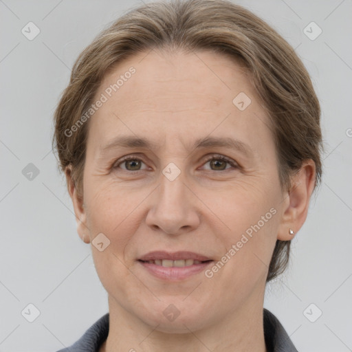 Joyful white adult female with medium  brown hair and grey eyes