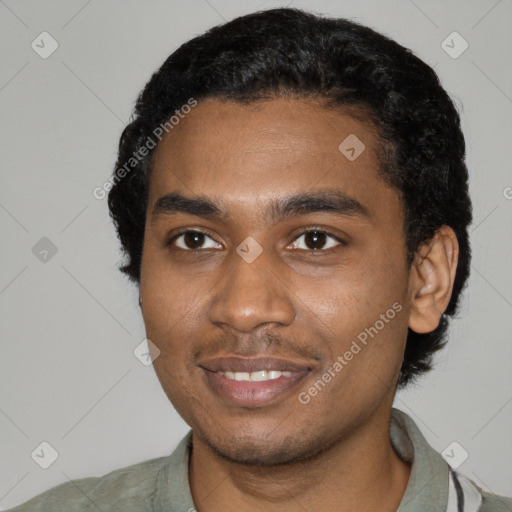 Joyful black young-adult male with short  black hair and brown eyes