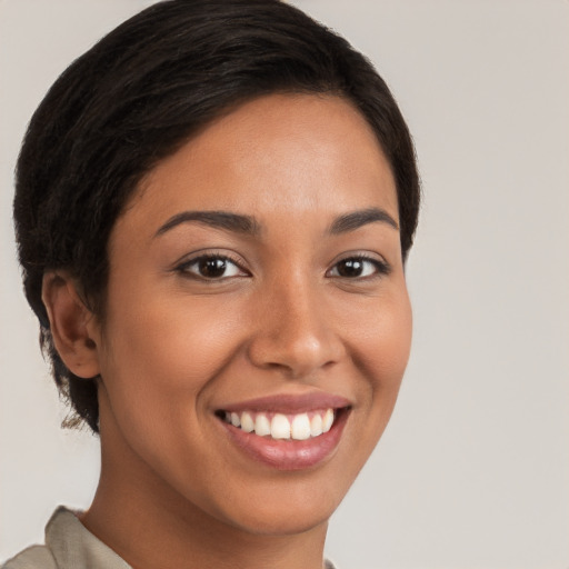 Joyful white young-adult female with short  brown hair and brown eyes