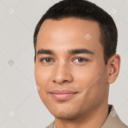 Joyful white young-adult male with short  black hair and brown eyes