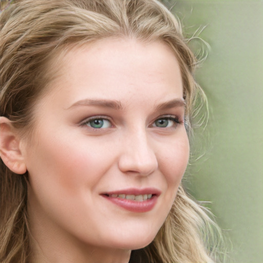 Joyful white young-adult female with long  brown hair and blue eyes