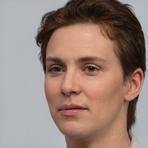 Joyful white adult female with medium  brown hair and brown eyes