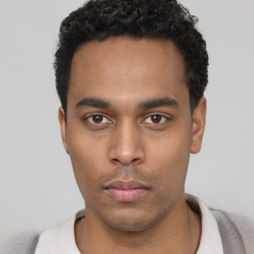 Neutral black young-adult male with short  black hair and brown eyes