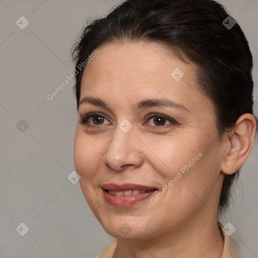 Joyful white adult female with medium  brown hair and brown eyes