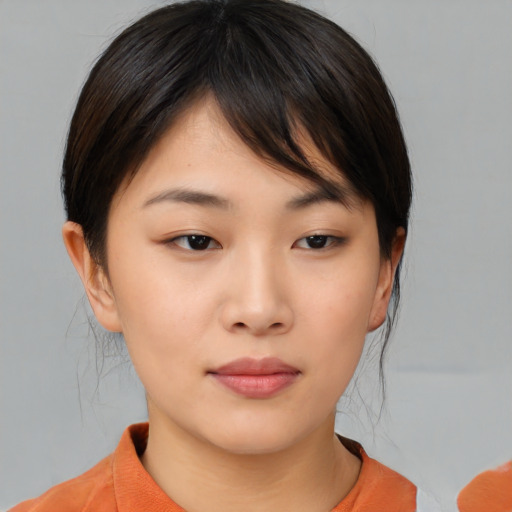 Neutral asian young-adult female with medium  brown hair and brown eyes