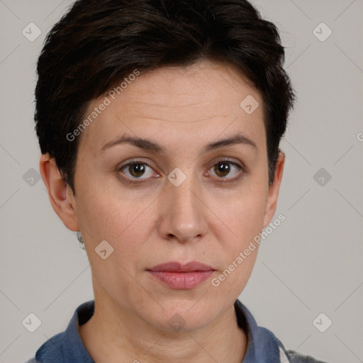 Joyful white adult female with short  brown hair and brown eyes