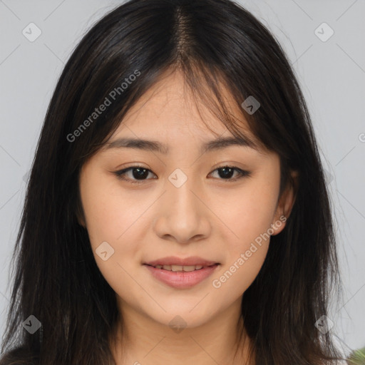 Joyful asian young-adult female with long  brown hair and brown eyes