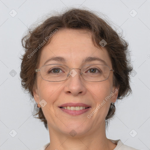 Joyful white adult female with short  brown hair and brown eyes