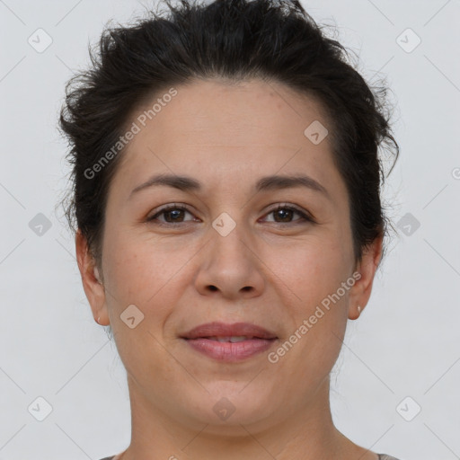 Joyful white adult female with short  brown hair and brown eyes