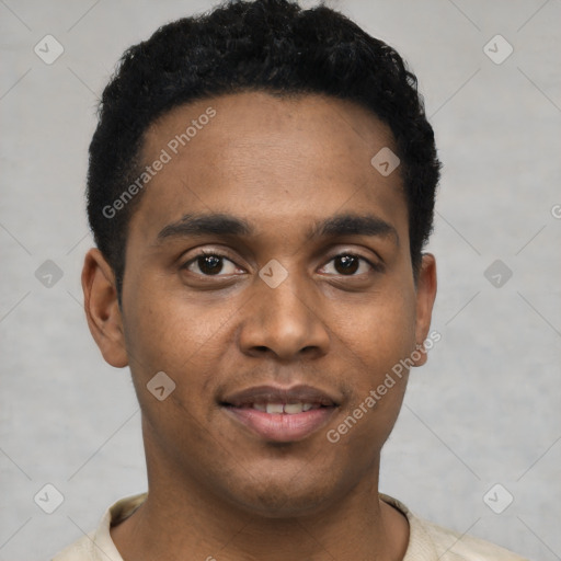 Joyful black young-adult male with short  black hair and brown eyes