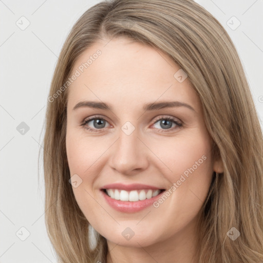 Joyful white young-adult female with long  brown hair and grey eyes