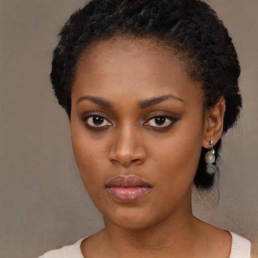 Neutral black young-adult female with medium  black hair and brown eyes