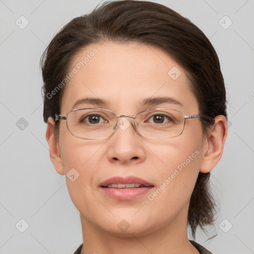 Joyful white adult female with short  brown hair and grey eyes