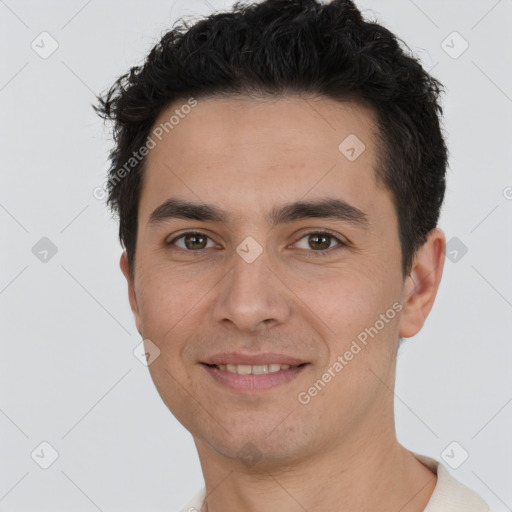 Joyful white young-adult male with short  black hair and brown eyes